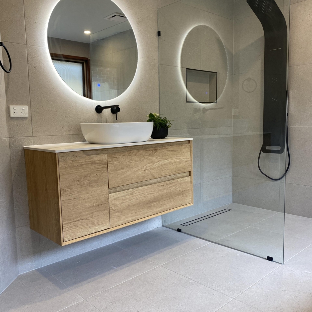 A newly renovated bathroom featuring modern fixtures and stylish decor