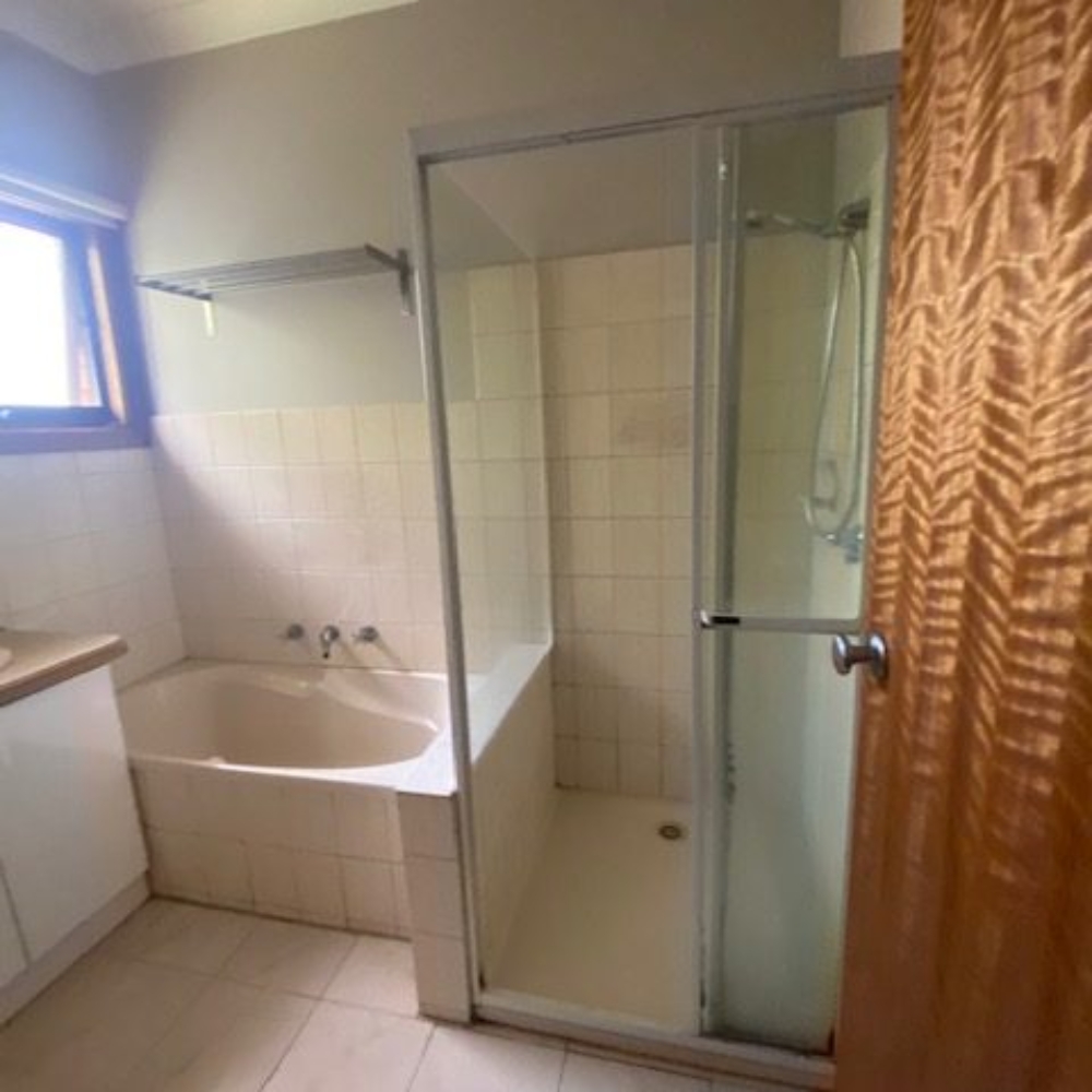 Updated bathroom remodeling with a spacious walk-in shower.